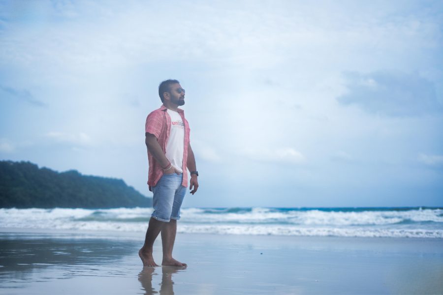 Abhishek Kumar standing on a beach in the Andaman Islands